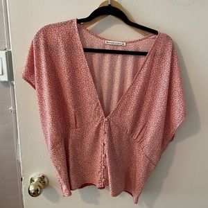 Deep v blouse with flutter sleeves.